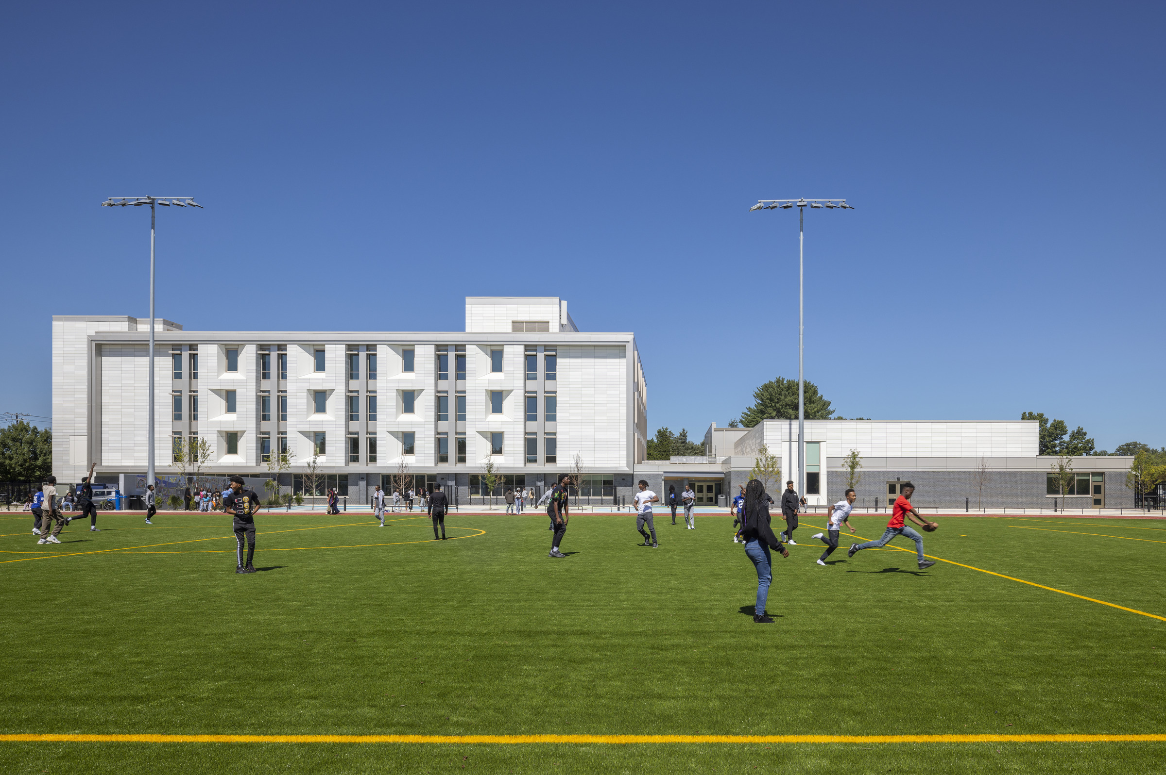 Bard Early College High School DC: playing field and rear elevation of the school and gym addition